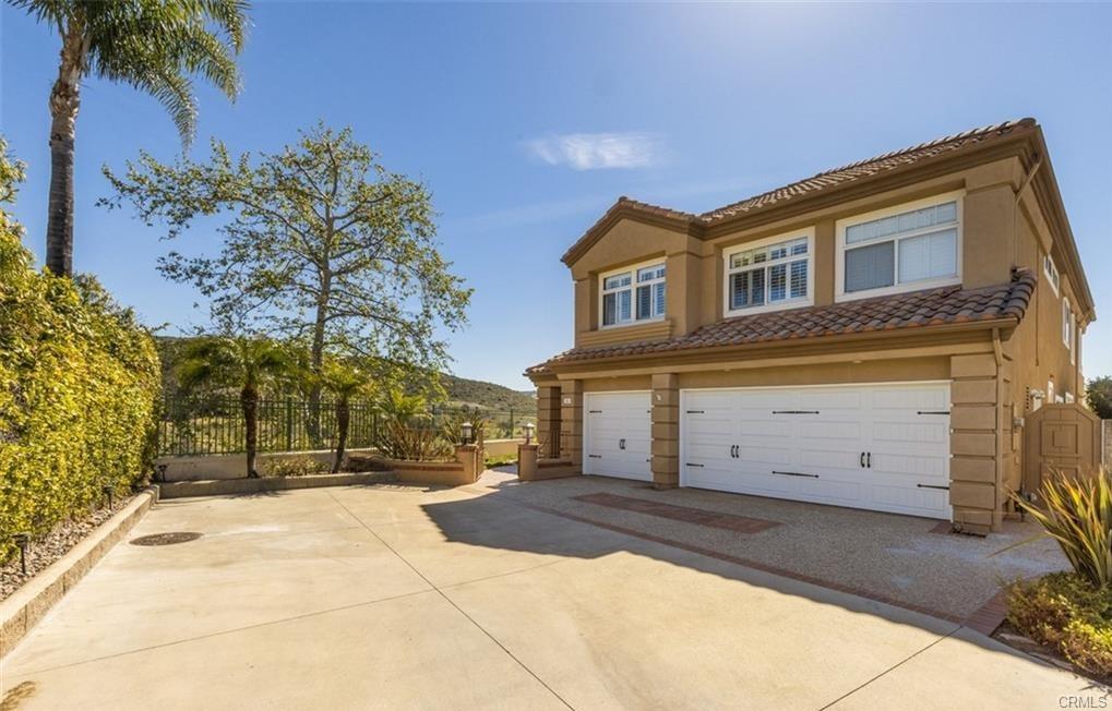 14 Dover — front elevation and three-car garage