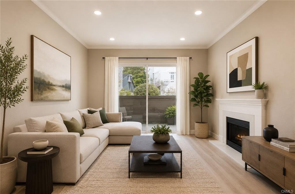 16440 Atherton St #26 — living room with fireplace, high ceilings, and slider to the private patio