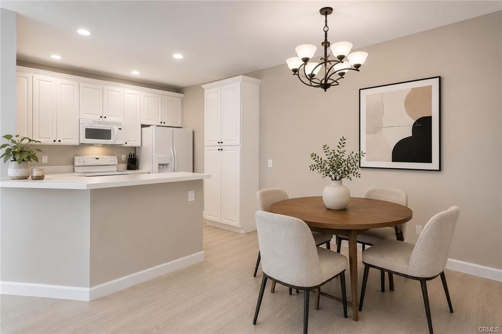 16440 Atherton St #26 — dining area with chandelier open to the kitchen