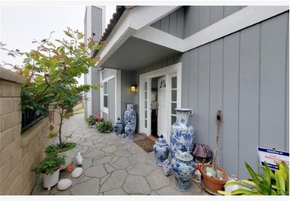 16143 Saint Croix — private entry courtyard with stone hardscape and coastal plantings