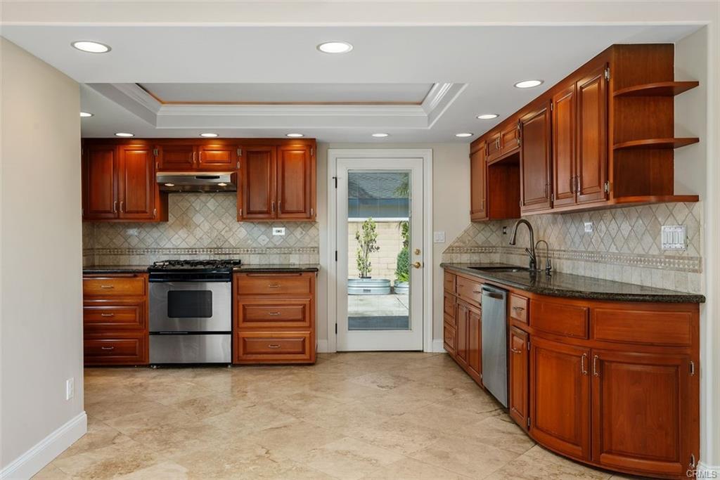 2199 National Ave — kitchen opening to the dining area with backyard access