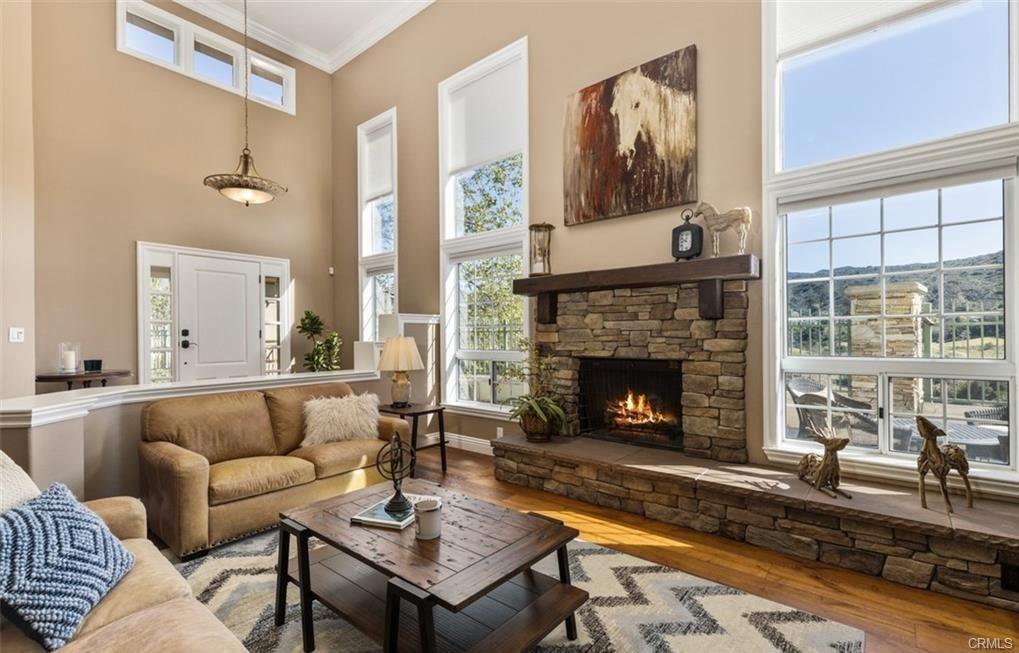 14 Dover — living room fireplace with wall of view windows