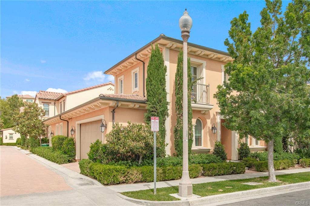115 Mustang — corner lot street view within the gated village