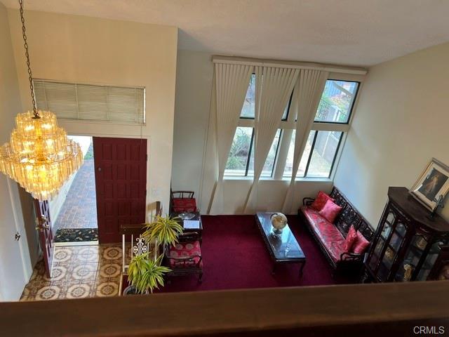 17031 Ward St — living room with vaulted ceiling seen from the upstairs landing
