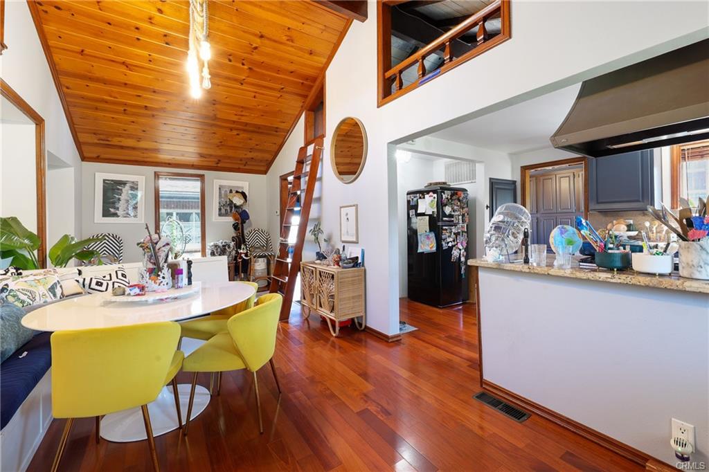 2642 Westminster Pl — open dining area with wood ceilings and hardwood floors