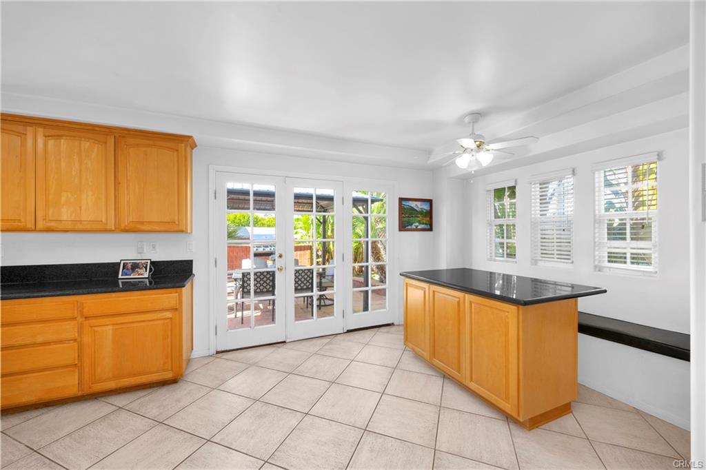 9112 Playa Dr — gourmet kitchen with granite counters and island