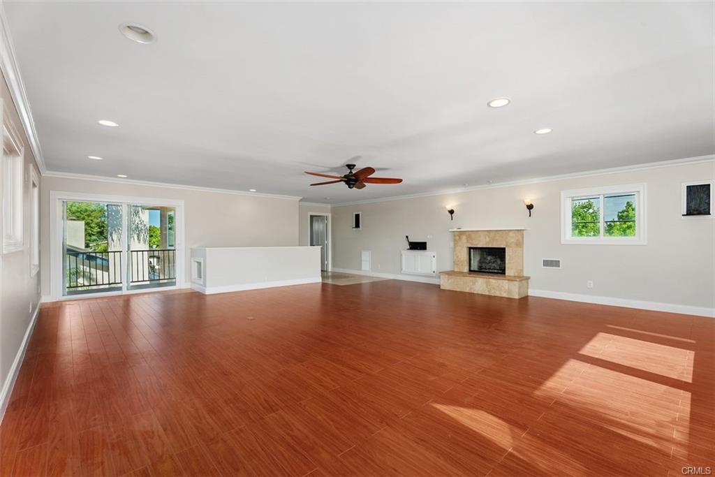 2199 National Ave — upstairs primary suite with fireplace and hardwood flooring