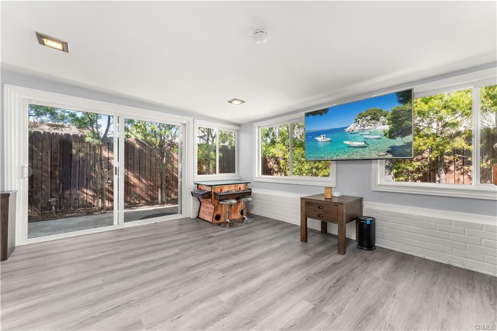 1170 Gleneagles — bonus room with dual sliders opening to the backyard