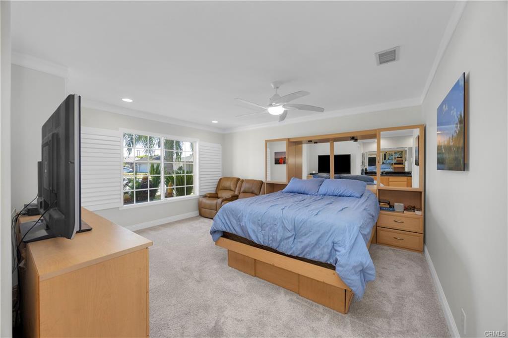 9112 Playa Dr — primary bedroom with vaulted ceiling