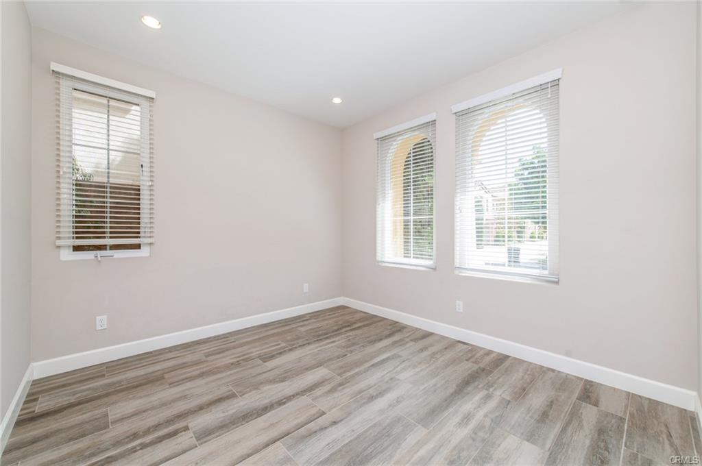 115 Mustang — main-floor bedroom with arched windows