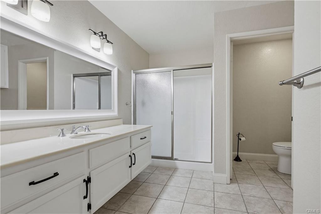 3650 S Bear St #77 — primary bath with dual vanity