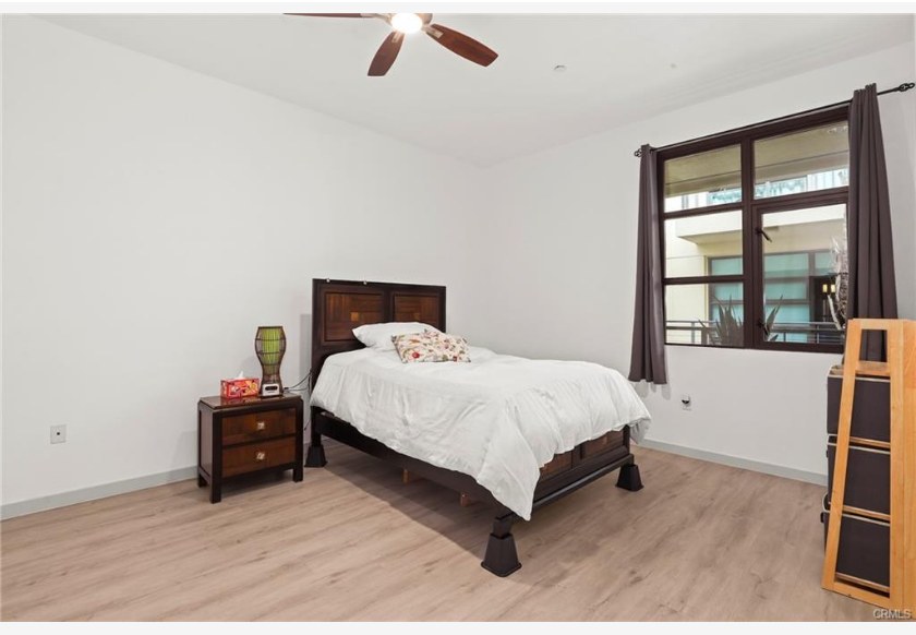 133 The Promenade N #318 — bedroom with luxury vinyl flooring and natural light
