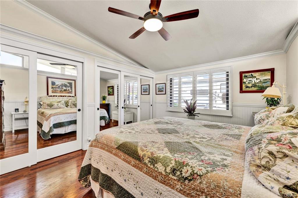 12231 Wilken Way — primary bedroom with vaulted ceiling and abundant natural light