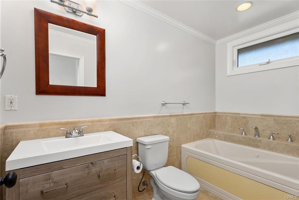 2199 National Ave — full bath with soaking tub and travertine surround