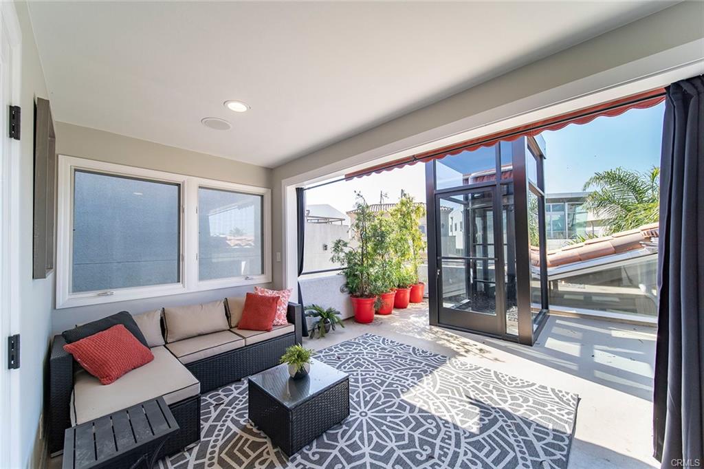 6063 Lido Ln — covered deck and terrace with bay views