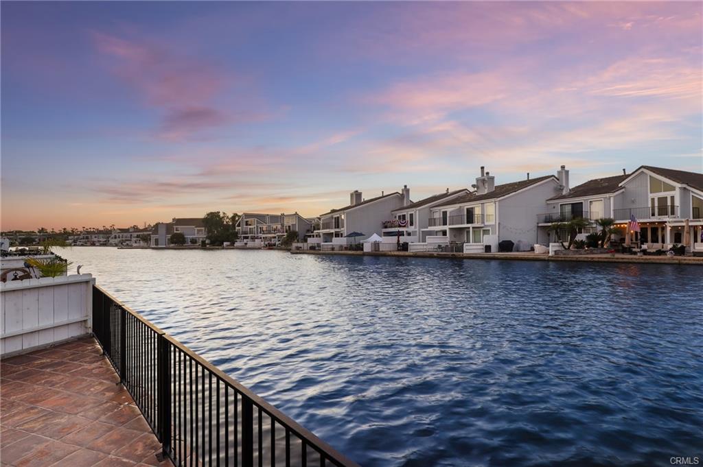 3631 Windspun Dr — water-level view along the Seagate lagoon at golden hour