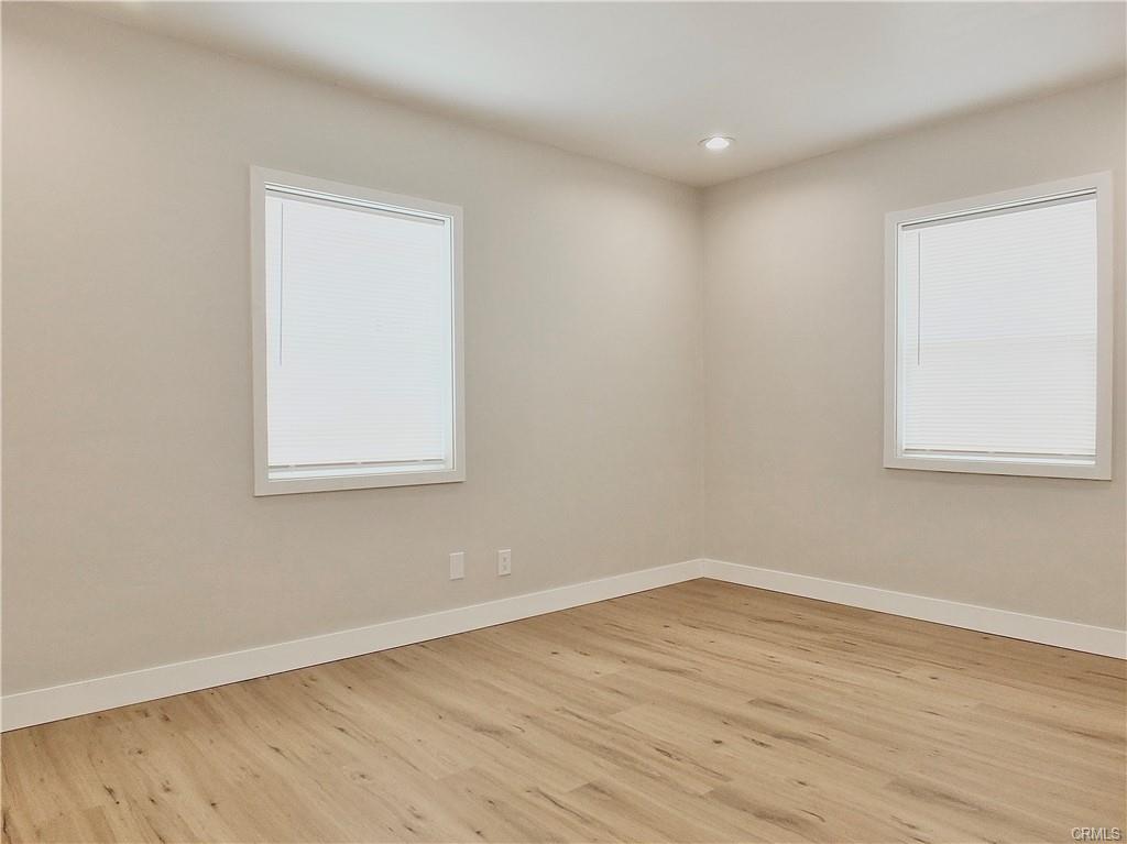 1335 W Burnett St — bright bedroom with new flooring and dual windows