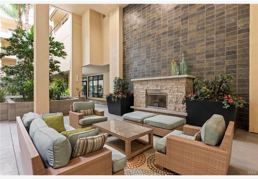 133 The Promenade N #318 — courtyard lounge with fireplace and outdoor seating