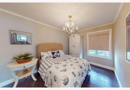 16143 Saint Croix — guest bedroom with coastal furnishings and natural light