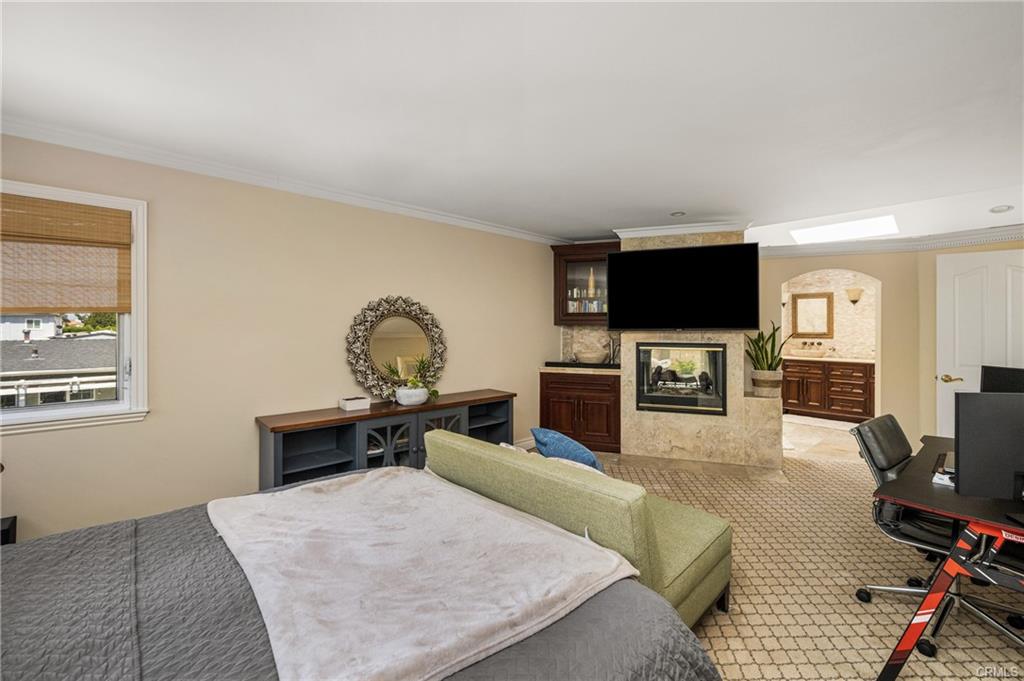 2342 Cynthia Ct — primary suite with double-sided fireplace