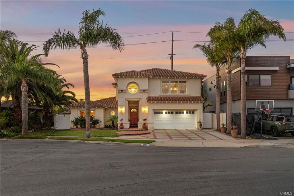 9112 Playa Dr — twilight street view of the home