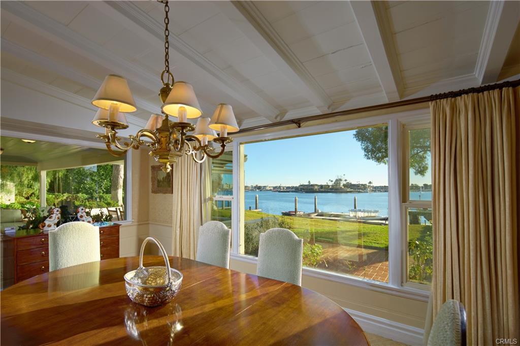 20 Harbor Island — dining room with beamed ceiling and harbor views