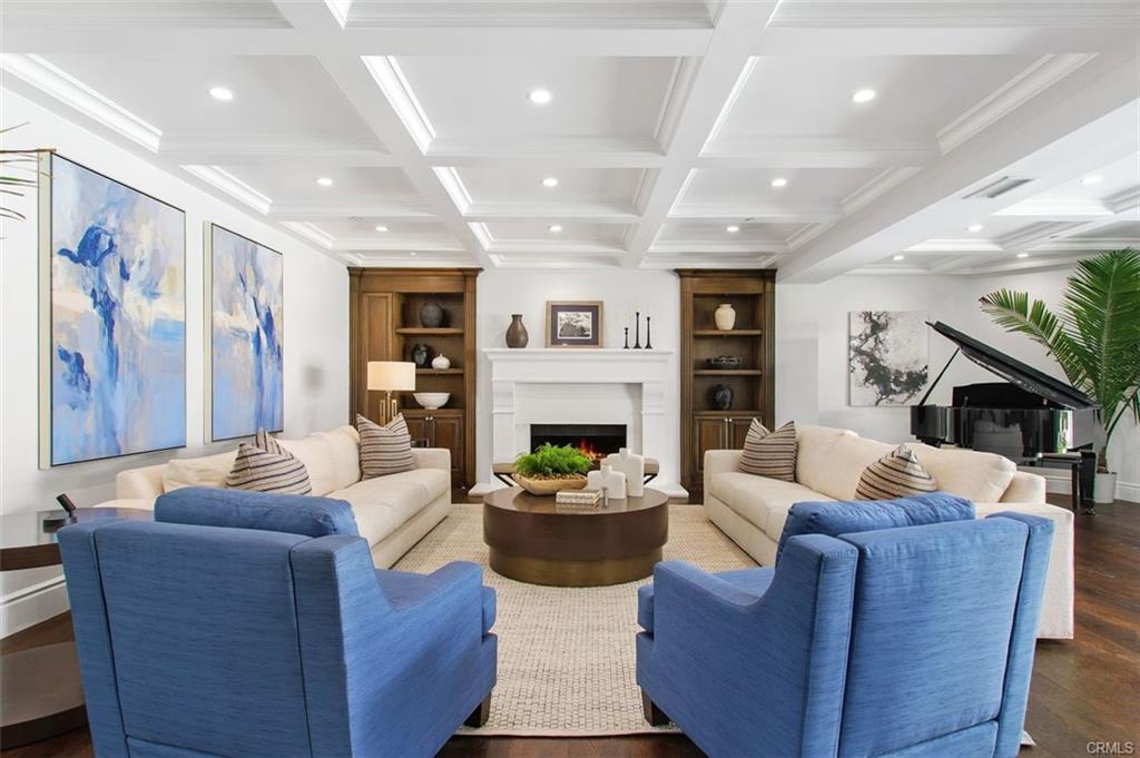 4 Inverness Lane — living room with fireplace and coffered ceiling