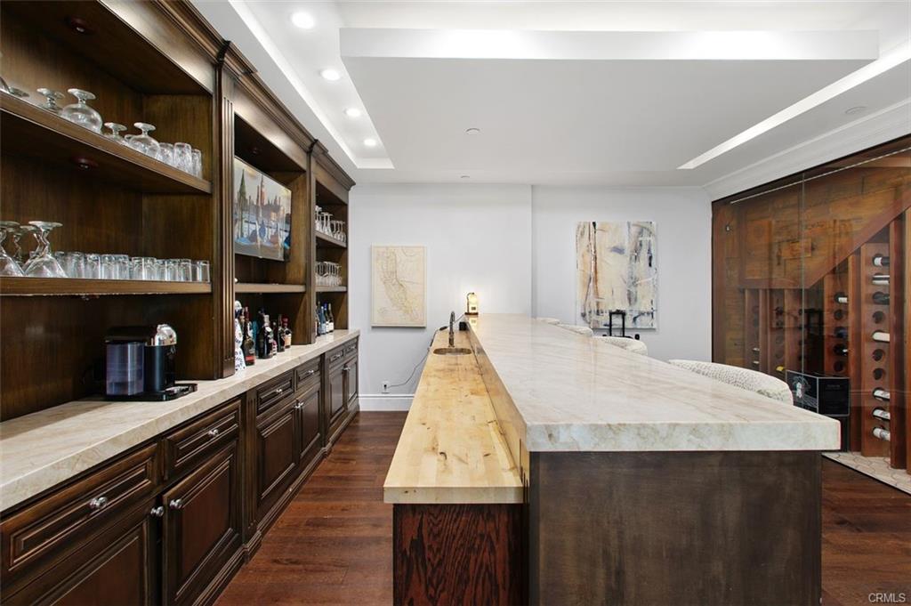 4 Inverness Lane — bar with stone counter and glass display shelving