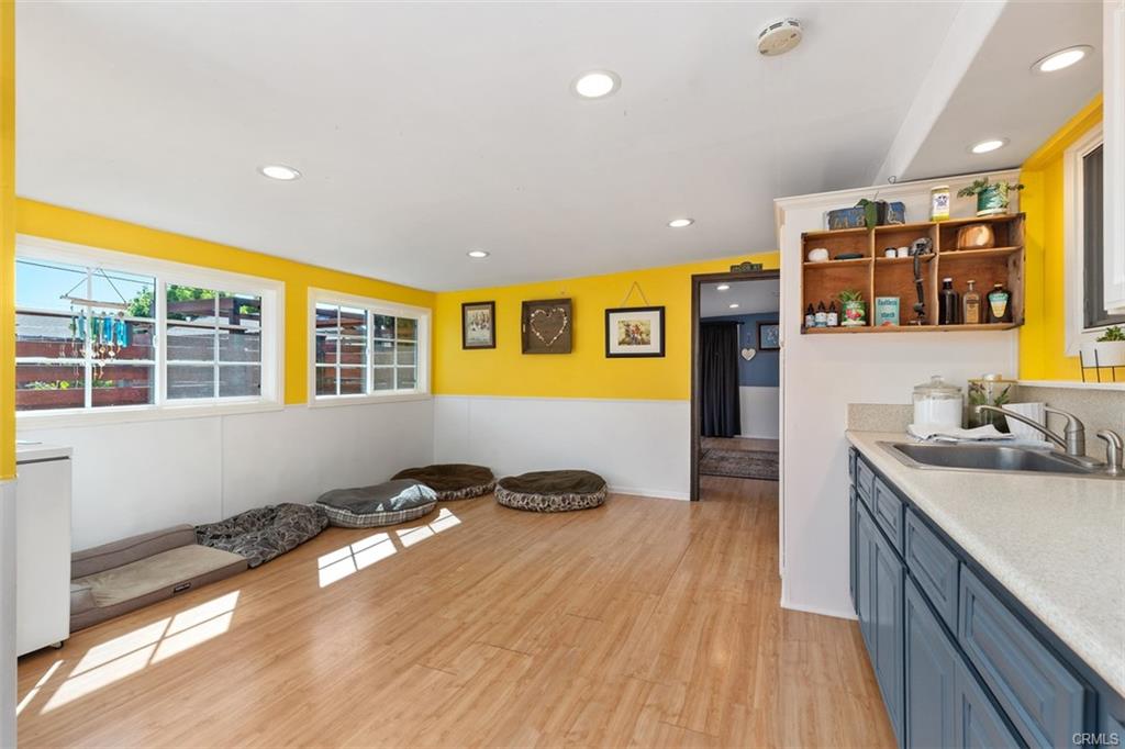 20292 Riverside Dr — kennel area with wash sink, cabinetry, and natural light